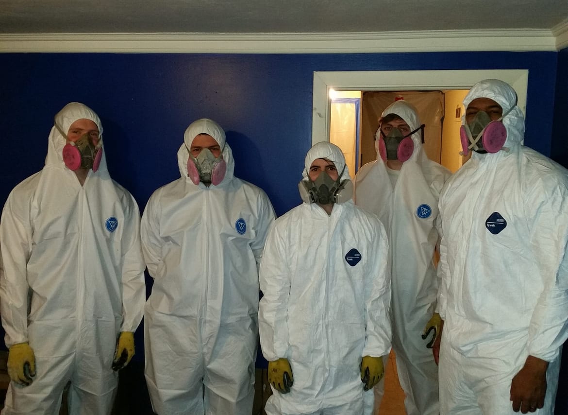 Signs of Water Damage in a Home: What You Need to Know 2 water damage restoration Phoenix specialists standing with mold remediation gear on